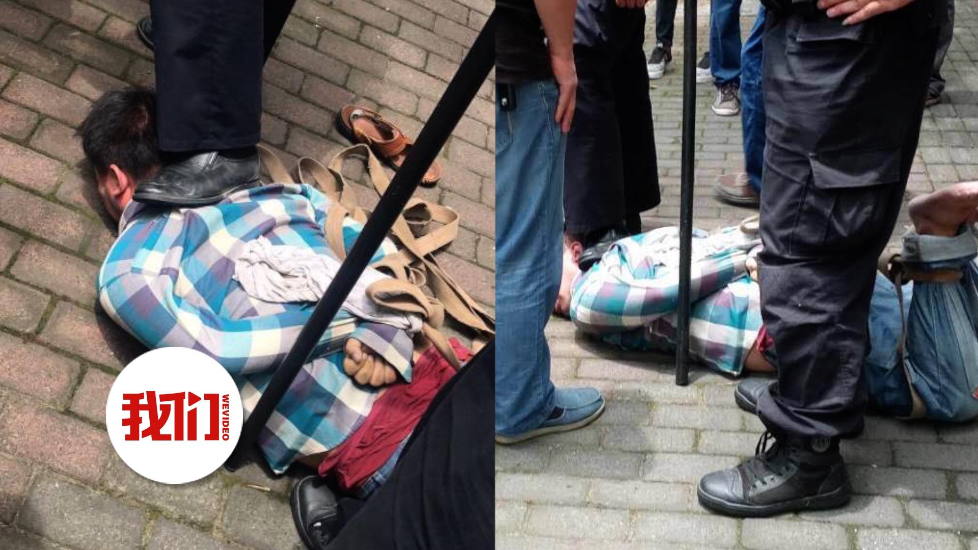 上海砍人男子被警民合力控制 五花大绑后愤怒市民对其猛踹